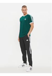 Adidas - adidas Spodnie dresowe Tiro IP3778 Czarny Regular Fit. Kolor: czarny. Materiał: bawełna #6