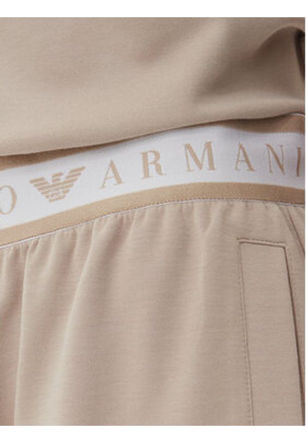 EA7 Emporio Armani Spodnie dresowe 7W000282 AF12501 U6155 Beżowy Loose Fit. Kolor: beżowy. Materiał: syntetyk