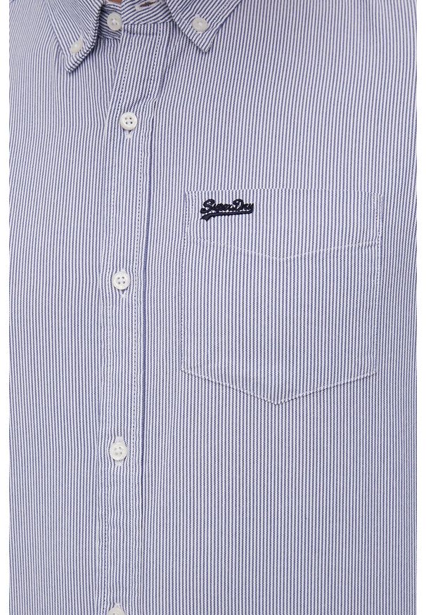 Superdry koszula bawełniana męska kolor granatowy regular z kołnierzykiem button-down. Typ kołnierza: button down. Kolor: niebieski. Materiał: bawełna. Długość rękawa: długi rękaw. Długość: długie