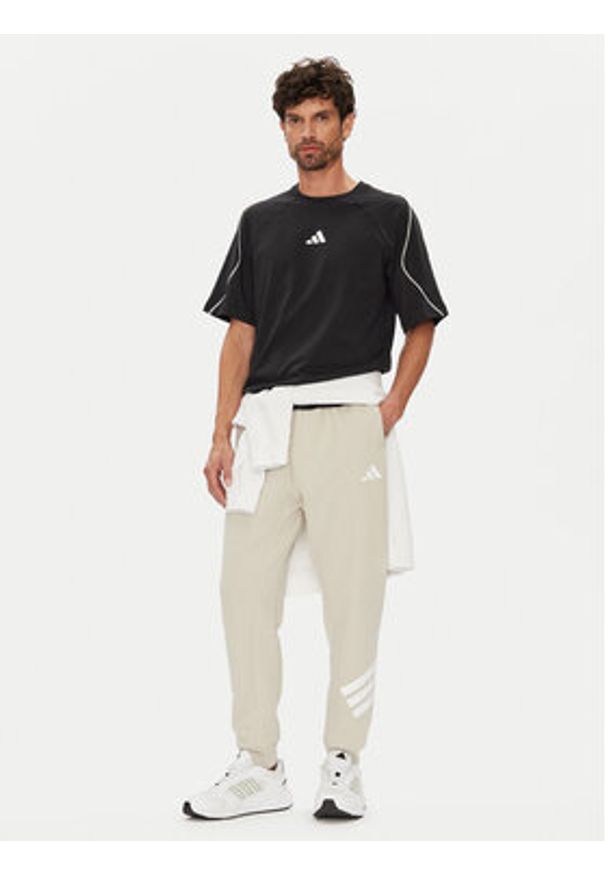 Adidas - adidas Spodnie dresowe Future Icons 3-Stripes JW7092 Beżowy Regular Fit. Kolor: beżowy. Materiał: bawełna