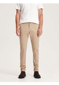 Reserved - Spodnie chino slim fit - beżowy. Kolor: beżowy. Materiał: bawełna, tkanina
