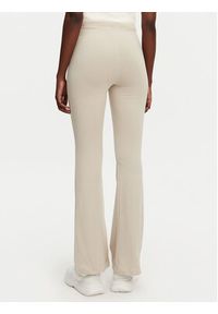 Adidas - adidas Legginsy Essentials Small Logo JD3072 Beżowy Flare Fit. Kolor: beżowy. Materiał: bawełna #4