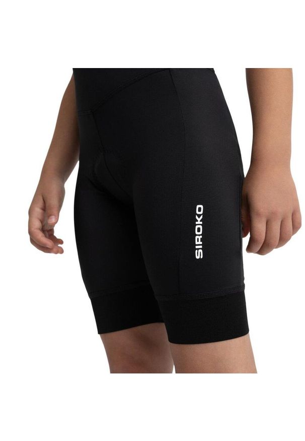 SIROKO - Dziewczęce krótkie spodenki rowerowe z wkładką Kolarstwo Siroko K-Core Racin. Kolor: czarny. Materiał: poliester, elastan. Długość: krótkie. Sezon: lato. Sport: kolarstwo