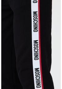 MOSCHINO Czarne męskie spodnie dresowe z lampasami, Rozmiar L. Kolor: czarny. Materiał: dresówka