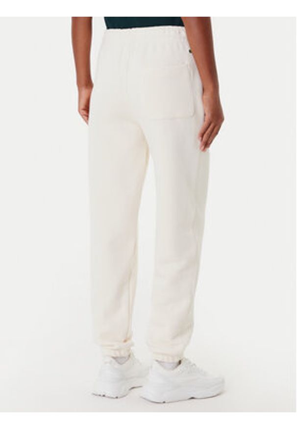 Lacoste Spodnie dresowe XF0353 Beżowy Regular Fit. Kolor: beżowy. Materiał: bawełna