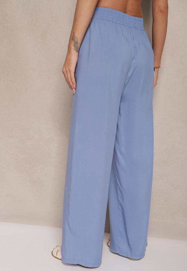 Renee - Niebieskie Szerokie Spodnie z Wiskozy High Waist Naivella. Okazja: na co dzień. Stan: podwyższony. Kolor: niebieski. Materiał: wiskoza. Styl: elegancki, casual