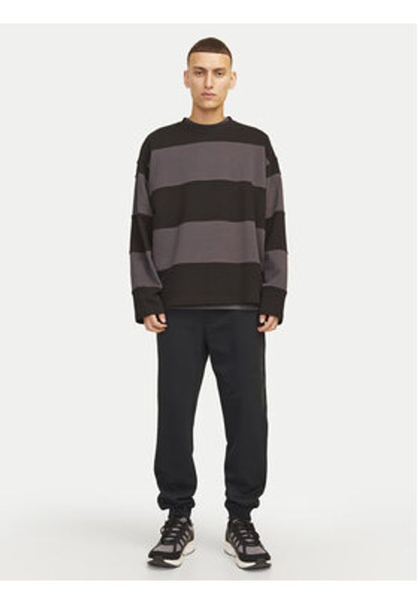 Jack & Jones Spodnie dresowe Gordon 12258477 Czarny Regular Fit. Kolor: czarny. Materiał: syntetyk, bawełna