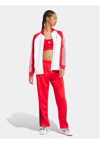 Adidas - adidas Spodnie dresowe adicolor Classics SST IM9809 Czerwony Loose Fit. Kolor: czerwony. Materiał: bawełna, syntetyk