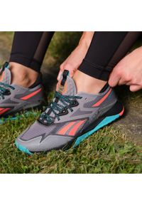 Buty Kobieta Reebok Nano X2 Tr Adventure pomarańczowy. Okazja: na co dzień. Kolor: czarny, pomarańczowy, wielokolorowy, żółty. Sport: fitness