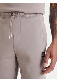 Hugo - HUGO Spodnie dresowe Dimacs 50533695 Beżowy Relaxed Fit. Kolor: beżowy. Materiał: bawełna #4