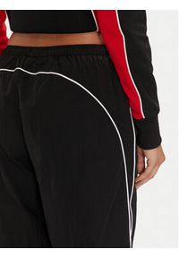 Fila Spodnie dresowe Laplace FAW0891 Czarny Loose Fit. Kolor: czarny. Materiał: syntetyk