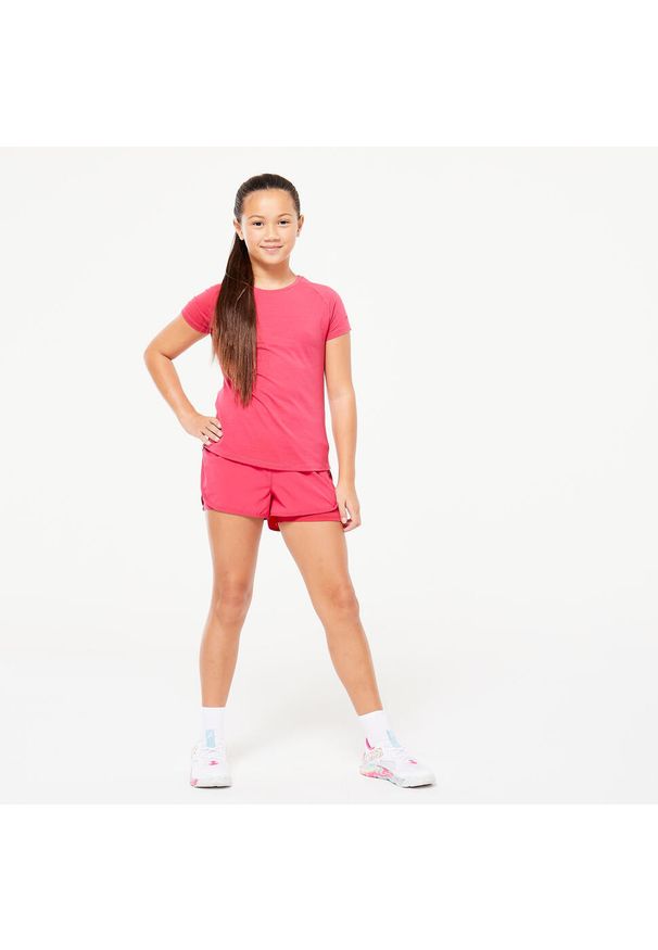 Decathlon - Koszulka z krótkim rękawem dziecięca Domyos S500. Kolor: różowy. Materiał: materiał, lyocell, poliester, elastan. Długość rękawa: krótki rękaw. Długość: krótkie
