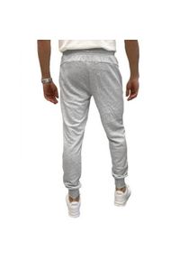 Puma - Spodnie Do Joggingu Męskie Logo ESS. Kolor: szary. Materiał: dresówka. Sport: bieganie