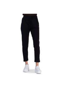 Spodnie Champion C Logo Fleece Slim Joggers 116609-KK001 - czarne. Kolor: czarny. Materiał: bawełna, elastan, dresówka. Wzór: haft