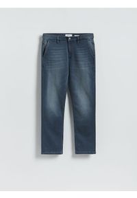 Reserved - Jeansy slim fit z efektem sprania - granatowy. Kolor: niebieski
