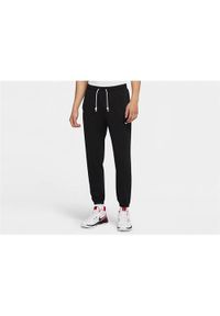 Spodnie sportowe męskie Nike Standard Issue. Kolor: czarny, beżowy, wielokolorowy. Materiał: dresówka