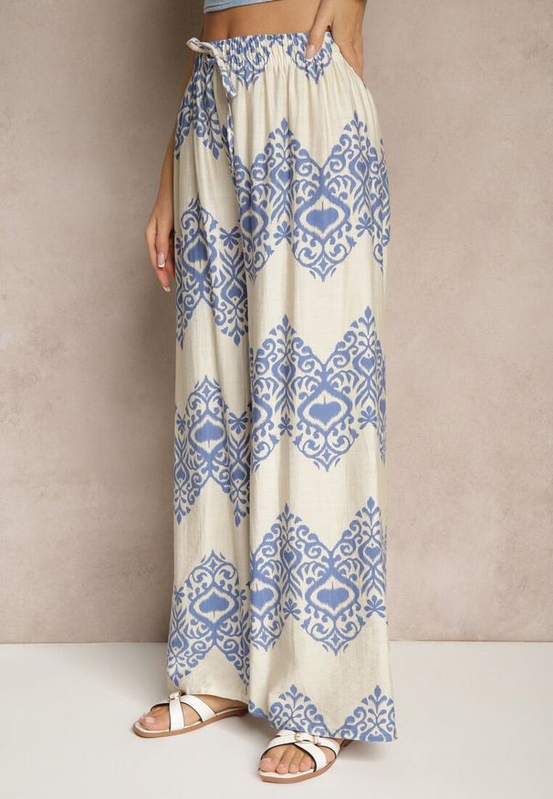 Renee - Niebieskie Spodnie z Wiskozy o Szerokim Kroju High Waist ze Wzorem Boho Neolissea. Okazja: na co dzień, na spacer. Stan: podwyższony. Kolor: niebieski. Materiał: wiskoza. Sezon: lato. Styl: boho