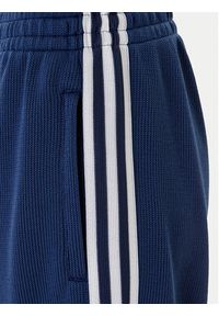 Adidas - adidas Spodnie dresowe adicolor Firebird JV7524 Granatowy Regular Fit. Kolor: niebieski. Materiał: syntetyk #4