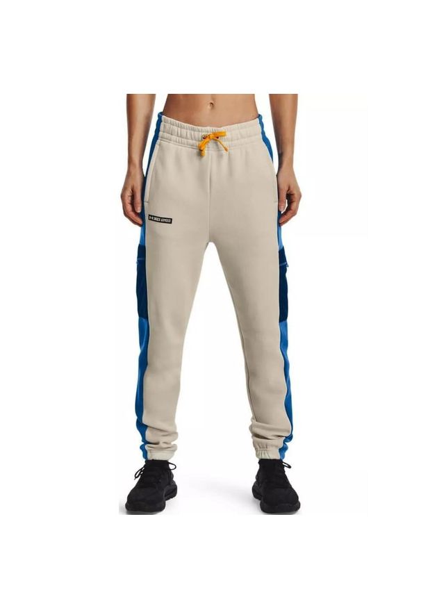 Under Armour - Spodnie treningowe Rival Fleece SP Pant - piaskowy. Kolor: beżowy. Materiał: dresówka