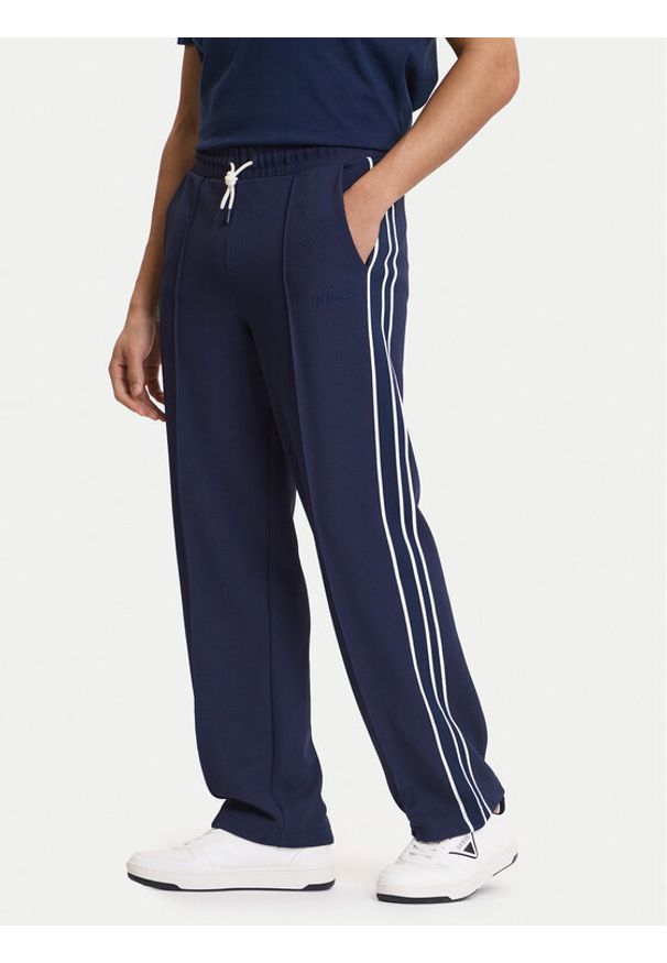 Guess Spodnie dresowe Z6GB14 K3211 Granatowy Regular Fit. Kolor: niebieski. Materiał: syntetyk