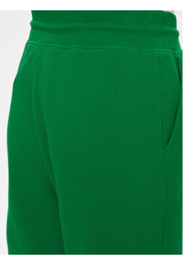 TOMMY HILFIGER - Tommy Hilfiger Spodnie dresowe UW0UW04946 Zielony Relaxed Fit. Kolor: zielony. Materiał: bawełna