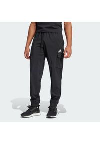 Adidas - Spodnie Essentials Small Logo Cargo. Kolor: biały, czarny, wielokolorowy. Materiał: materiał. Sport: fitness