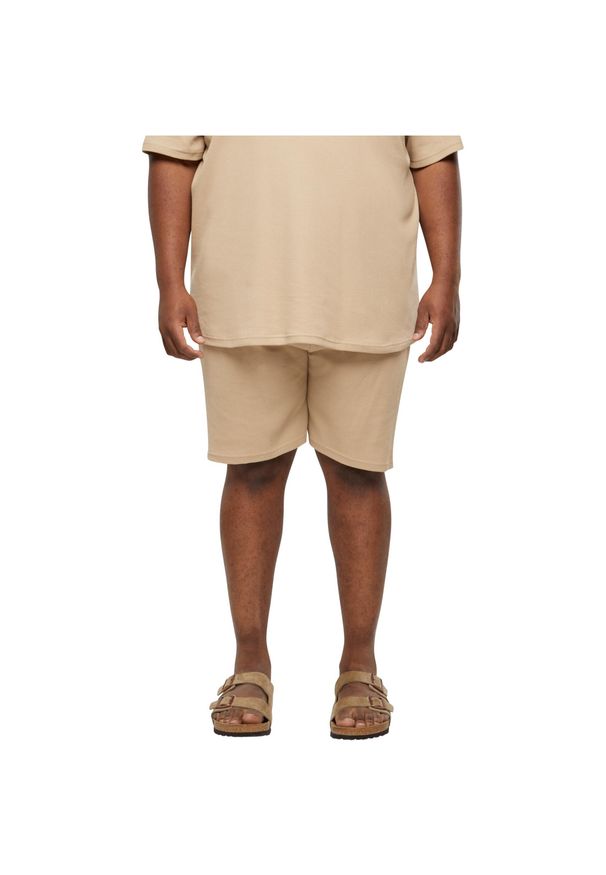 Szorty Urban Classics Waffle. Kolor: beżowy. Materiał: materiał. Długość: krótkie. Sezon: lato