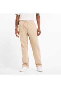 Spodnie męskie New Balance MP44587SNW – beżowe. Kolor: beżowy. Materiał: poliester, bawełna #1