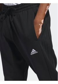 Adidas - adidas Spodnie dresowe Essentials HZ2218 Czarny Regular Fit. Kolor: czarny. Materiał: bawełna #5