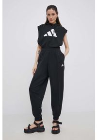 Adidas - adidas spodnie HD6768 damskie kolor czarny gładkie. Stan: podwyższony. Kolor: czarny. Materiał: bawełna, włókno, dzianina, materiał. Wzór: gładki #4