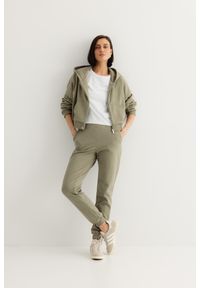 SPODNIE JOGGERS OLIWKA XS - Flawless. Materiał: dresówka, skóra, materiał, bawełna. Długość: długie. Styl: klasyczny, sportowy, elegancki