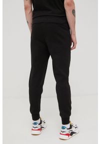 Puma spodnie 586714 męskie kolor czarny z nadrukiem. Kolor: czarny. Materiał: materiał, dzianina. Wzór: nadruk #4