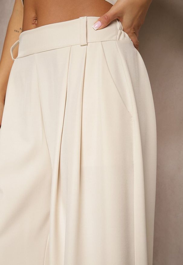 Renee - Beżowe Eleganckie Spodnie Palazzo z Szerokimi Nogawkami Adivisa. Stan: podwyższony. Kolor: beżowy. Styl: elegancki