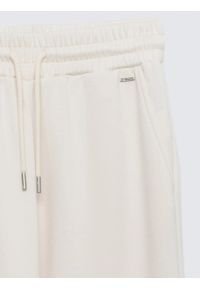 Big-Star - Spodnie damskie dresowe z szeroką nogawką kremowe Lunarap 102. Kolor: kremowy. Materiał: dresówka. Styl: elegancki #2