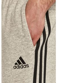 Adidas - adidas Spodnie GK8889 męskie. Kolor: szary. Materiał: poliester, dzianina. Wzór: nadruk, melanż #4