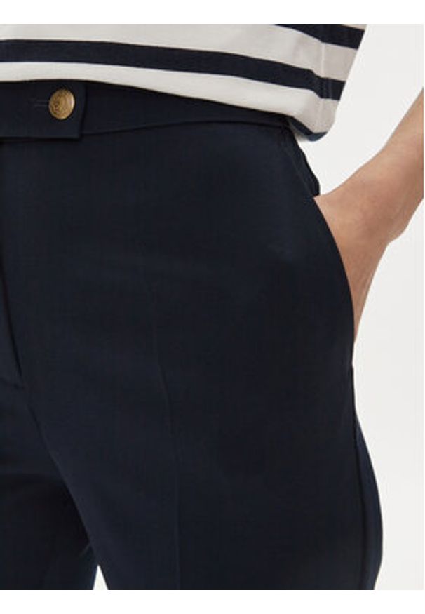 TOMMY HILFIGER - Tommy Hilfiger Spodnie materiałowe Gold Button WW0WW42455 Granatowy Flare Fit. Kolor: niebieski. Materiał: syntetyk