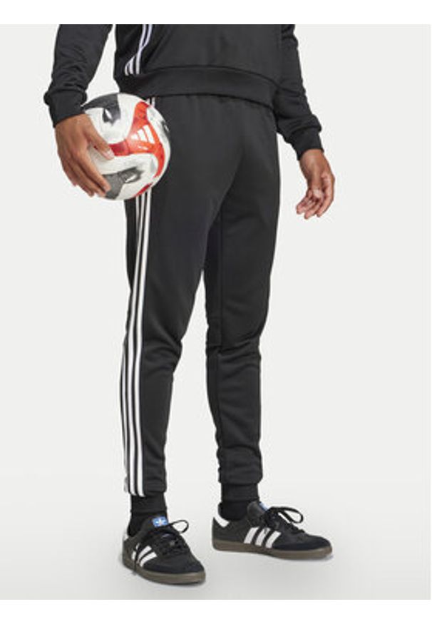 Adidas - adidas Spodnie dresowe Tiro 25 Essentials Sweat JC5464 Czarny Regular Fit. Kolor: czarny. Materiał: syntetyk