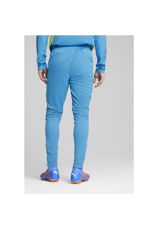 Puma - Męskie spodnie treningowe Manchester City PUMA Magic Blue Yellow Glow. Kolor: żółty, wielokolorowy, niebieski