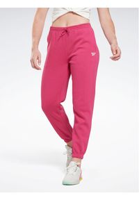 Reebok Spodnie dresowe Identity H54768 Różowy Regular Fit. Kolor: różowy. Materiał: dresówka, syntetyk