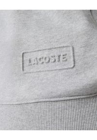 Lacoste - LACOSTE - Szara bluza oversize z kapturem. Typ kołnierza: kaptur. Kolor: szary #7