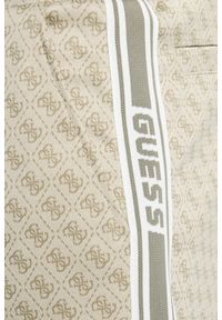 Guess - GUESS Beżowe męskie spodnie dresowe z lampasami w zielony monogram Parimo 4G Cuffed, Rozmiar XXL. Kolor: beżowy. Materiał: dresówka #3