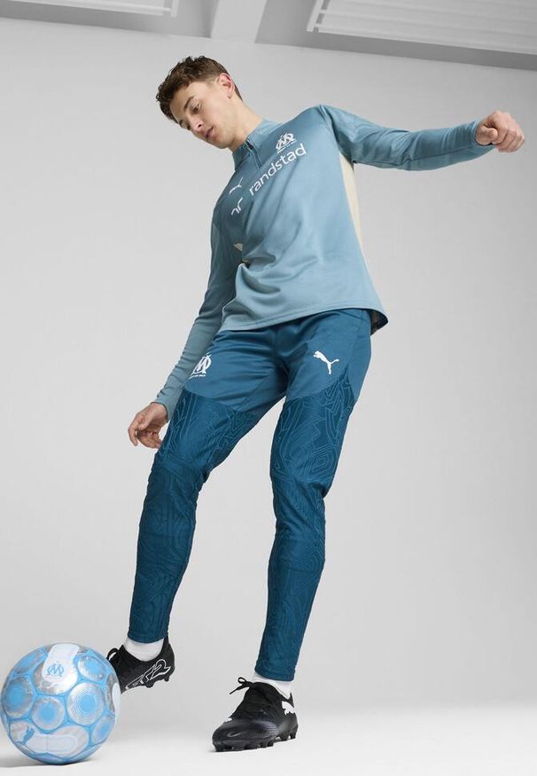 Puma - Męska bluza treningowa Olympique Marsylia z zamkiem 1/4 PUMA. Kolor: wielokolorowy, beżowy, niebieski. Sport: fitness