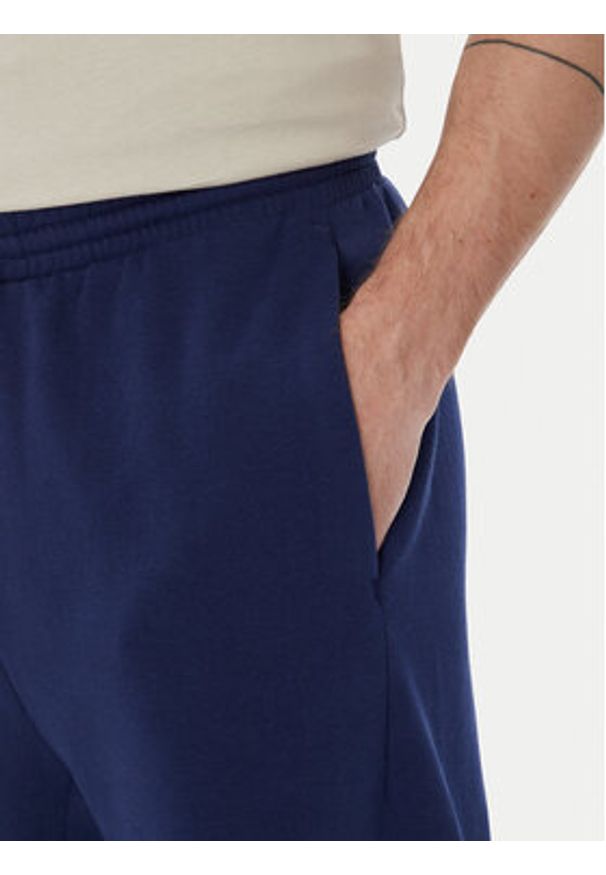 Adidas - adidas Spodnie dresowe Collegiate JM9179 Niebieski Regular Fit. Kolor: niebieski. Materiał: bawełna, syntetyk