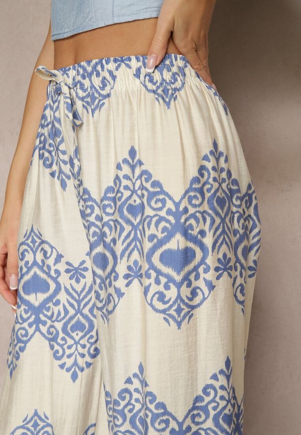 Renee - Niebieskie Spodnie z Wiskozy o Szerokim Kroju High Waist ze Wzorem Boho Neolissea. Okazja: na spacer, na co dzień. Stan: podwyższony. Kolor: niebieski. Materiał: wiskoza. Sezon: lato. Styl: boho