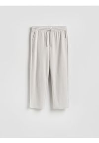 Reserved - Spodnie z wiązaniem - jasnoszary. Kolor: szary. Materiał: dzianina, bawełna