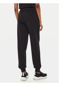 Calvin Klein Jeans Spodnie dresowe Monologo J20J223590 Czarny Relaxed Fit. Kolor: czarny. Materiał: bawełna, syntetyk