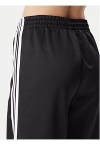 Adidas - adidas Spodnie dresowe Satin Sst KS9372 Czarny Loose Fit. Kolor: czarny. Materiał: syntetyk #5