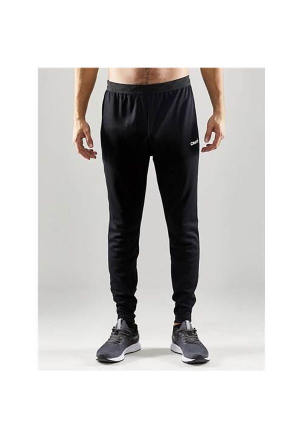 Spodnie treningowe męskie Craft Evolve Slim. Kolor: czarny. Materiał: dresówka. Sport: fitness