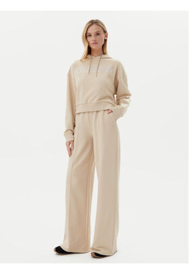 Guess Spodnie dresowe V5GB07 KCRP0 Beżowy Regular Fit. Kolor: beżowy. Materiał: bawełna