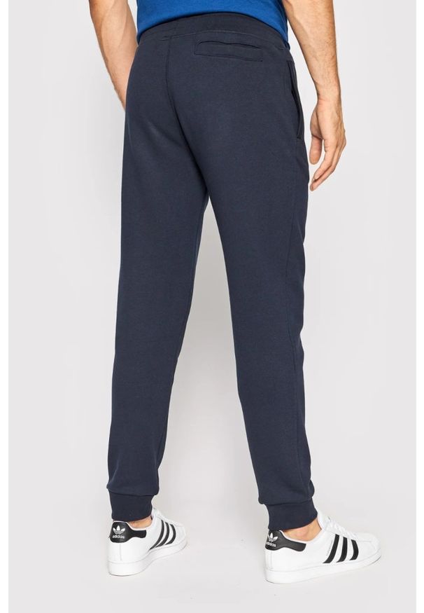 Guess - GUESS Granatowe męskie spodnie Aldwin, Rozmiar XL. Kolor: niebieski. Materiał: materiał, bawełna, poliester